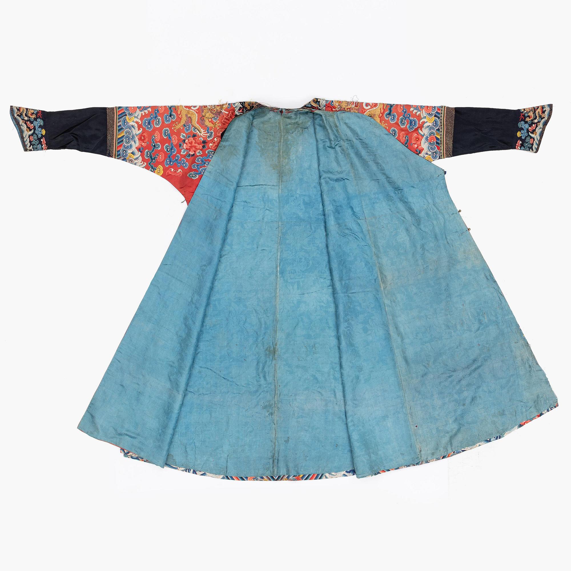 An embroidered red ground five clawed dragon 'female' formal robe, Qing dynasty, 19th century.