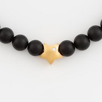 Ole Lynggaard, black stone  bead necklace, clasp star 18K gold with brilliant cut diamond.