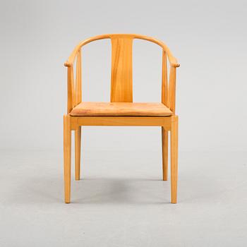 A Hans J Wegner 'Kinastolen' armchair, Fritz Hansen, Denmark 1971.