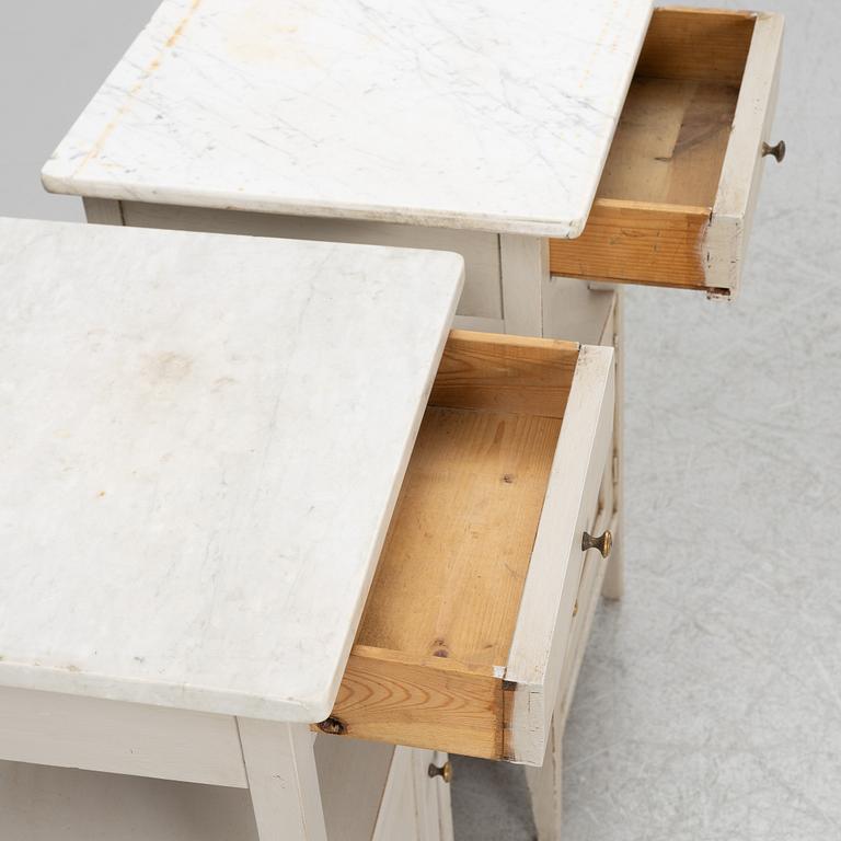 A matched pair of bedside tables.