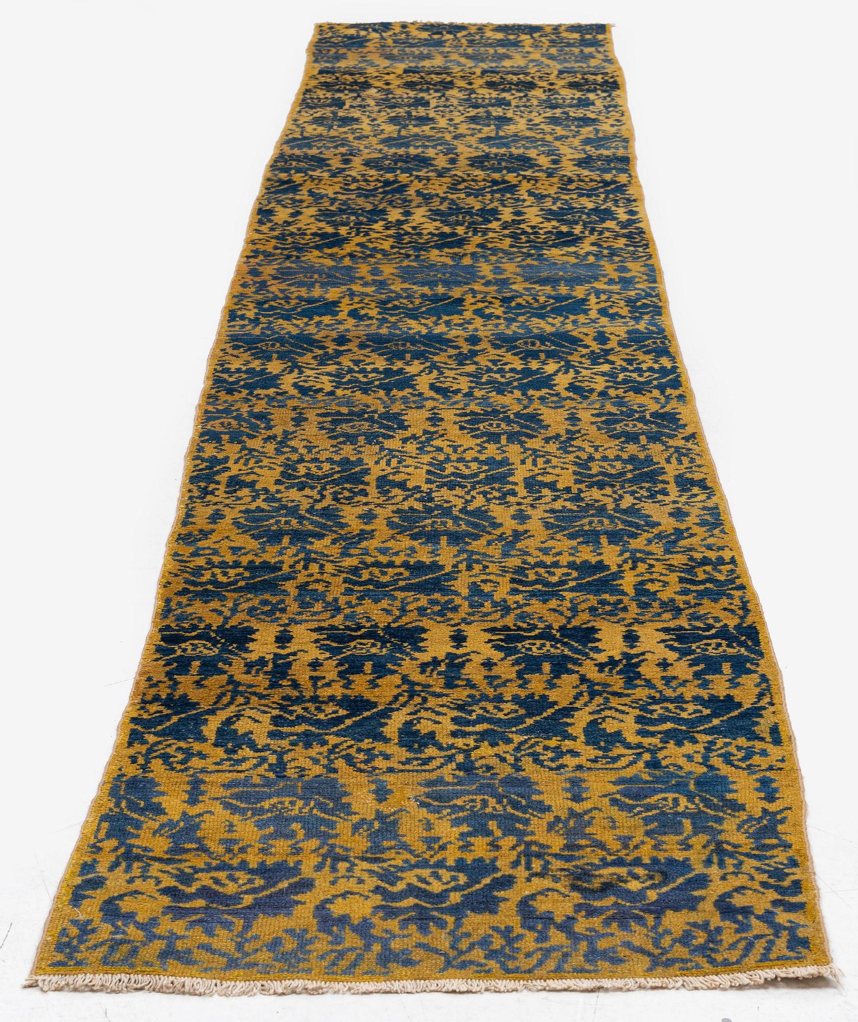 An antique Hamadan runner, Northwest Persia (Iran), c. 407 x 65 cm.