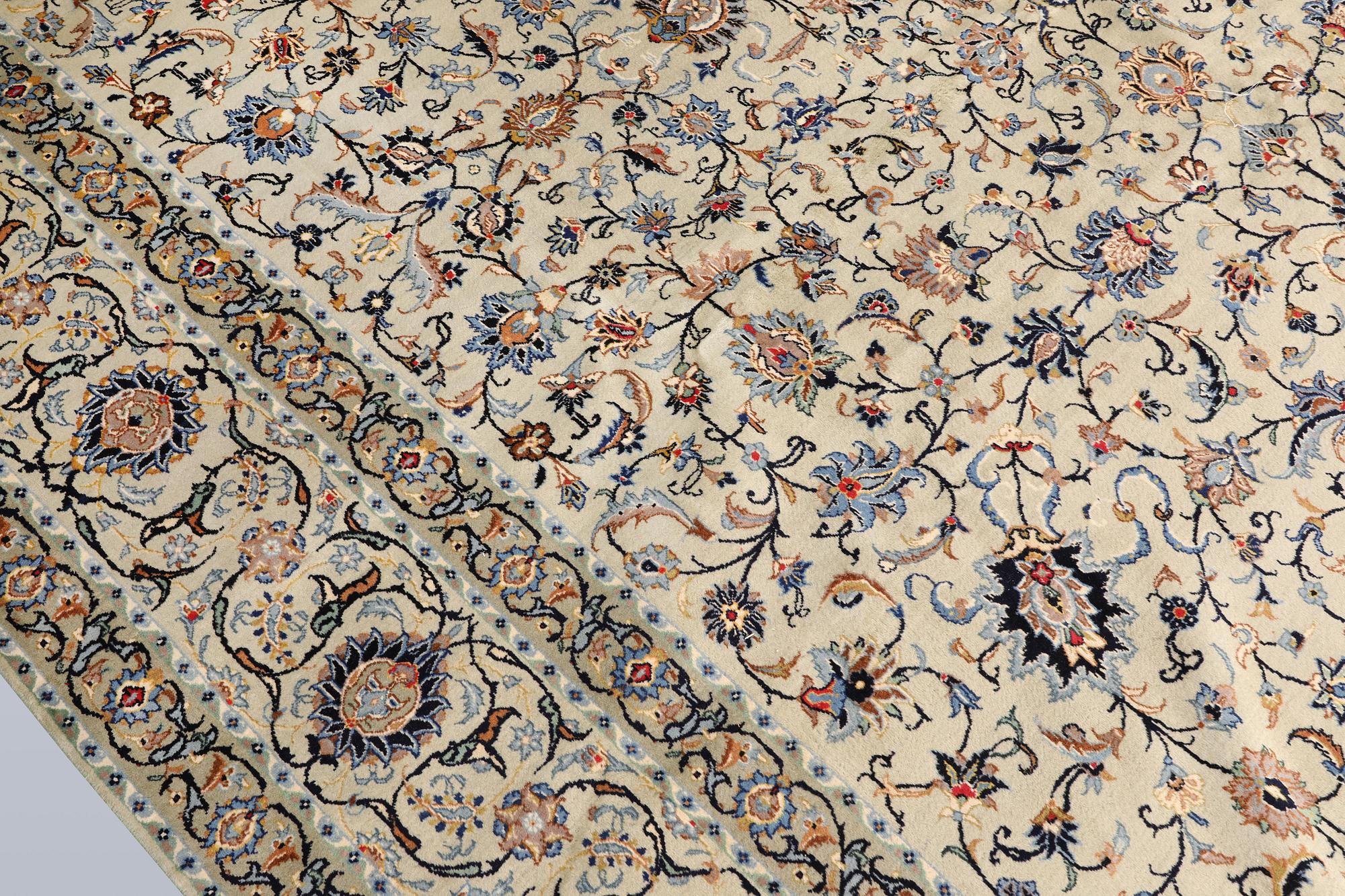 A Keshan carpet, signed, approx. 410 x 323 cm.