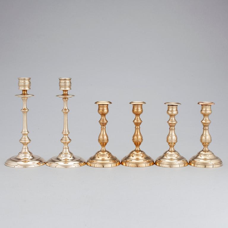 Three pair of candlesticks in brass, marked WMF, Westerås Metallfabrik and NLP. Late 19/early 20th century.