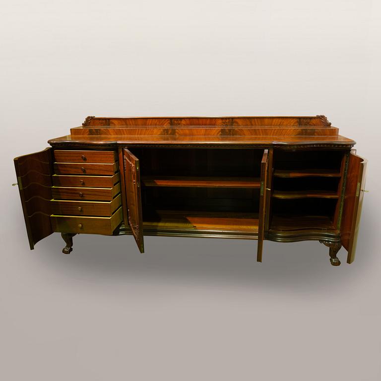 A 1920s Chippendale style buffet sideboard.