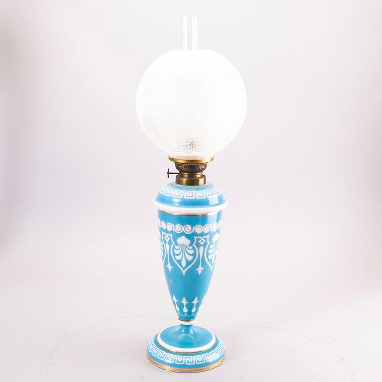 A glass paraffin lamp around 1900.