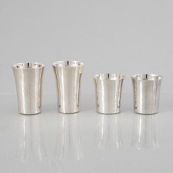 Eric Löfman, a Swedish silver candlestick, a vase and four cups, including MGAB, Uppsala 1977.