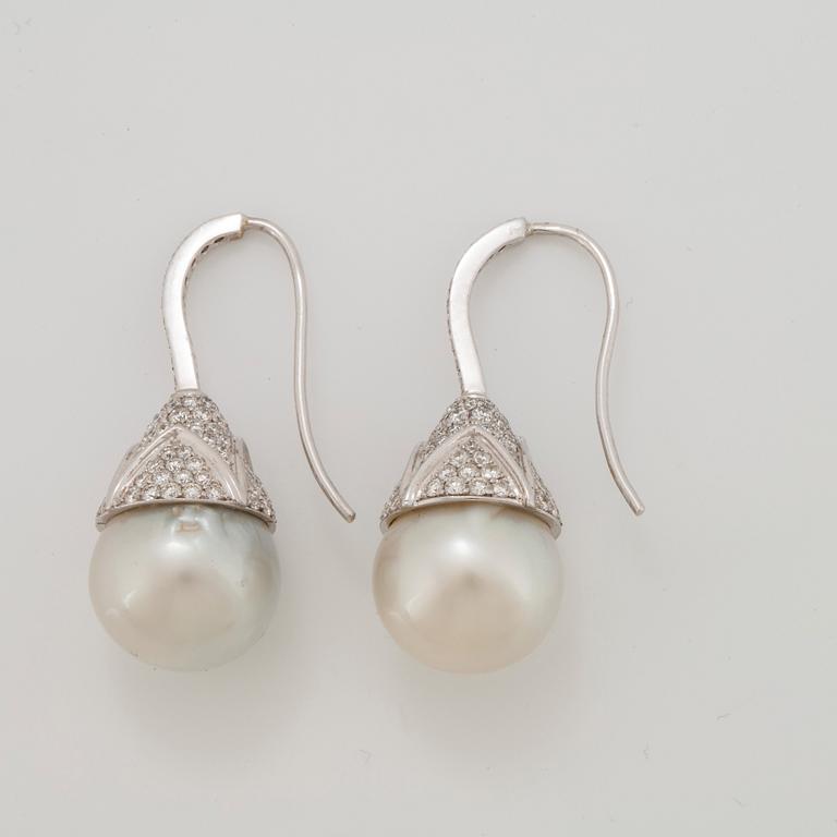 A pair of cultured South Sea pearl and diamond earrings.