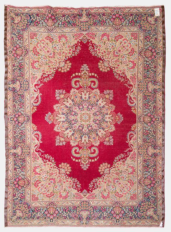 A carpet, Kirman, ca. 333 x 244 cm.