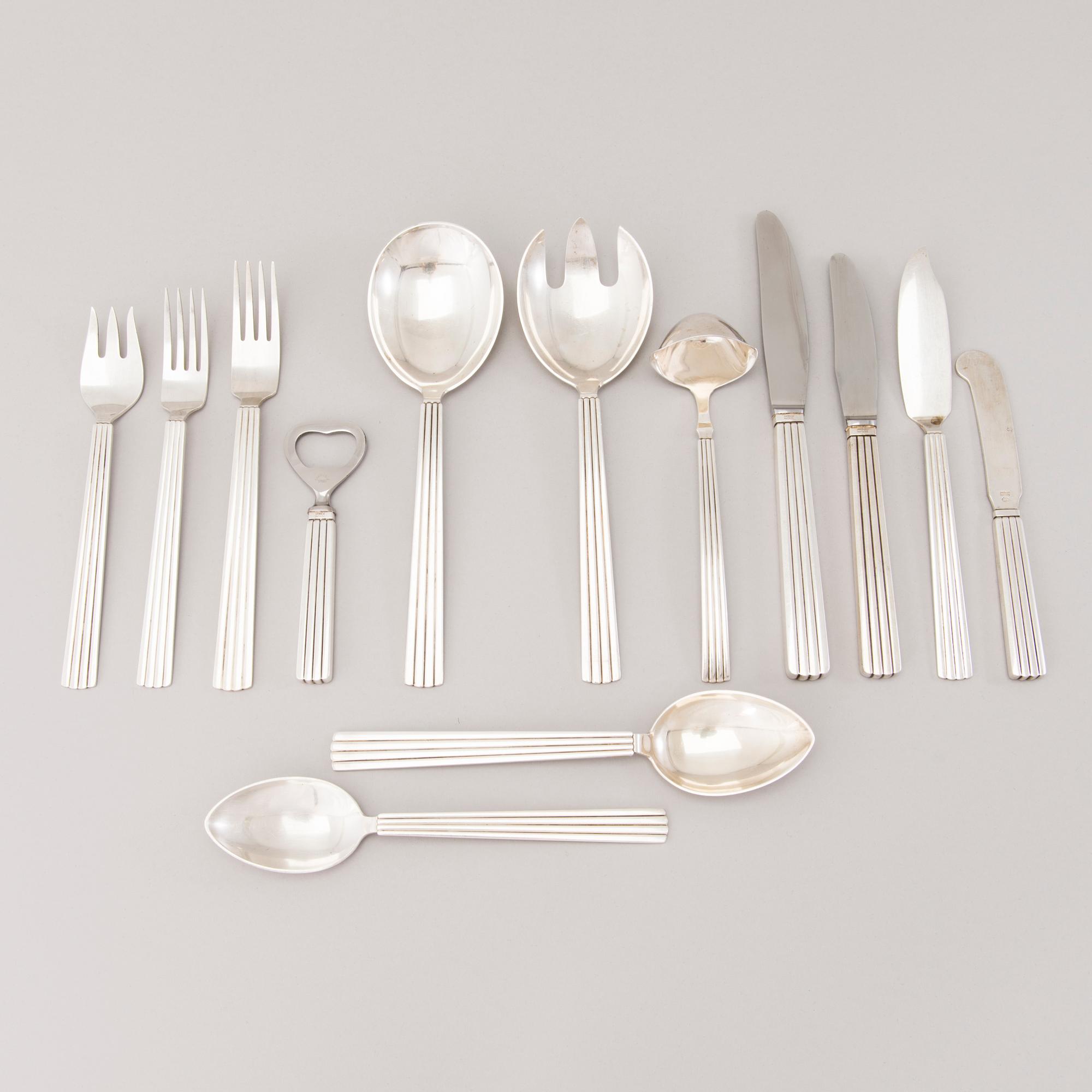 A 106 PIECE SILVER 'Bernadotte' cutlery set for George Jensen Denmark 1945-1977.