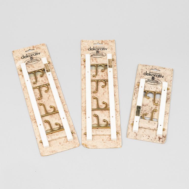 A set of three 'Dekorativ' coat hangers, Skoglunds metallgjuteri, Anderstorp, second half of the 20th century.