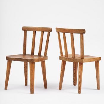 Axel Einar Hjorth, a set of seven stained pine "Utö" chairs, Nordiska Kompaniet, Sweden, 1930s.