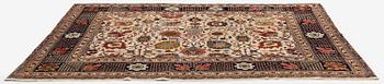 A semi-antique Tabriz carpet, Northwest Persia, of Safavid 'Vase' design, c.328 x 242 cm.