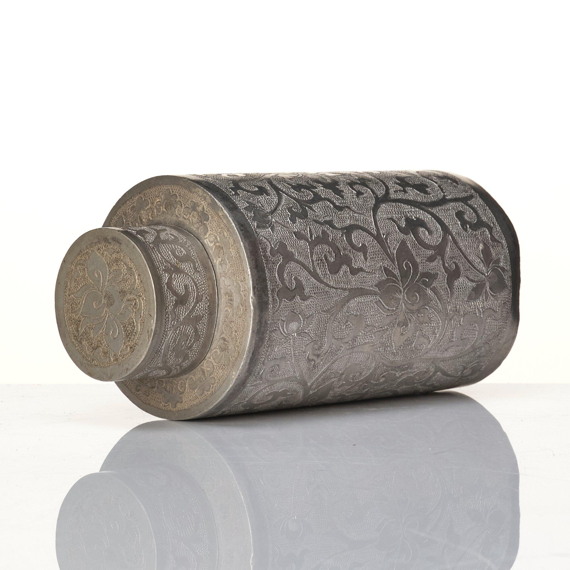 A Chinese lacquer box with a set of five pewter tea caddies, Qing dynasty, 18/19th Century.