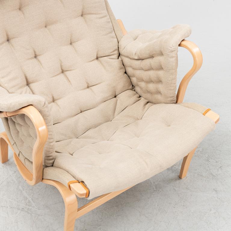 Bruno Mathsson, a 'Pernilla' armchair and a foot stool, Dux.