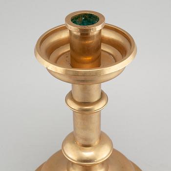 A brass candlestick by Erik Jonsson, Skara from the second half of the 20th century.