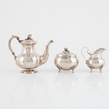 A silver coffee pot, a creamer and a sugarbowl, including S:t Petersburg, Russia 1858.