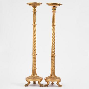 A pair of late Gustavian giltwood torchères by J. Frisk (master in Stockholm 1805-24).
