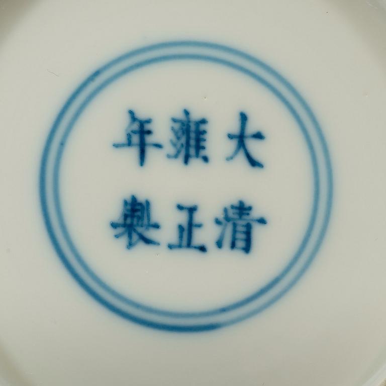 A pair of white-glazed small moulded dishes, Qing dynasty, Yongzheng six-character mark and of the period.