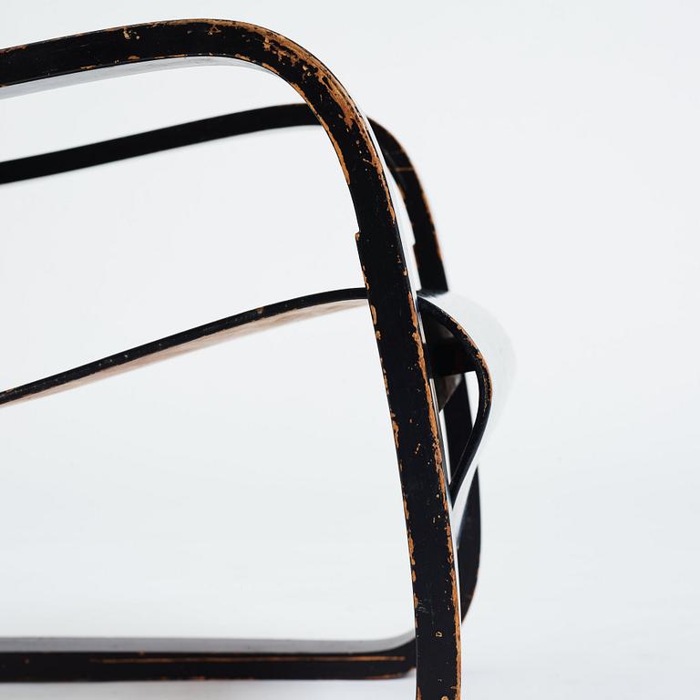 Alvar Aalto, a black lacquered birch cantilevered armchair, "nr 42", O.y Huonekalu-ja Rakennustyötehdas, Finland, 1930's.