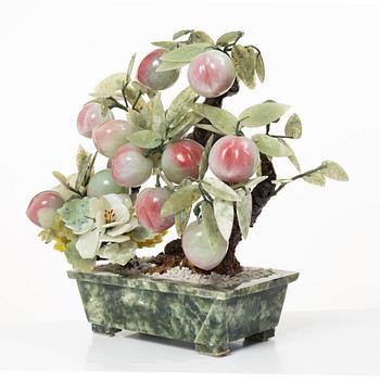 A stone table decoration in the shape of a peach tree, China, 20th century.