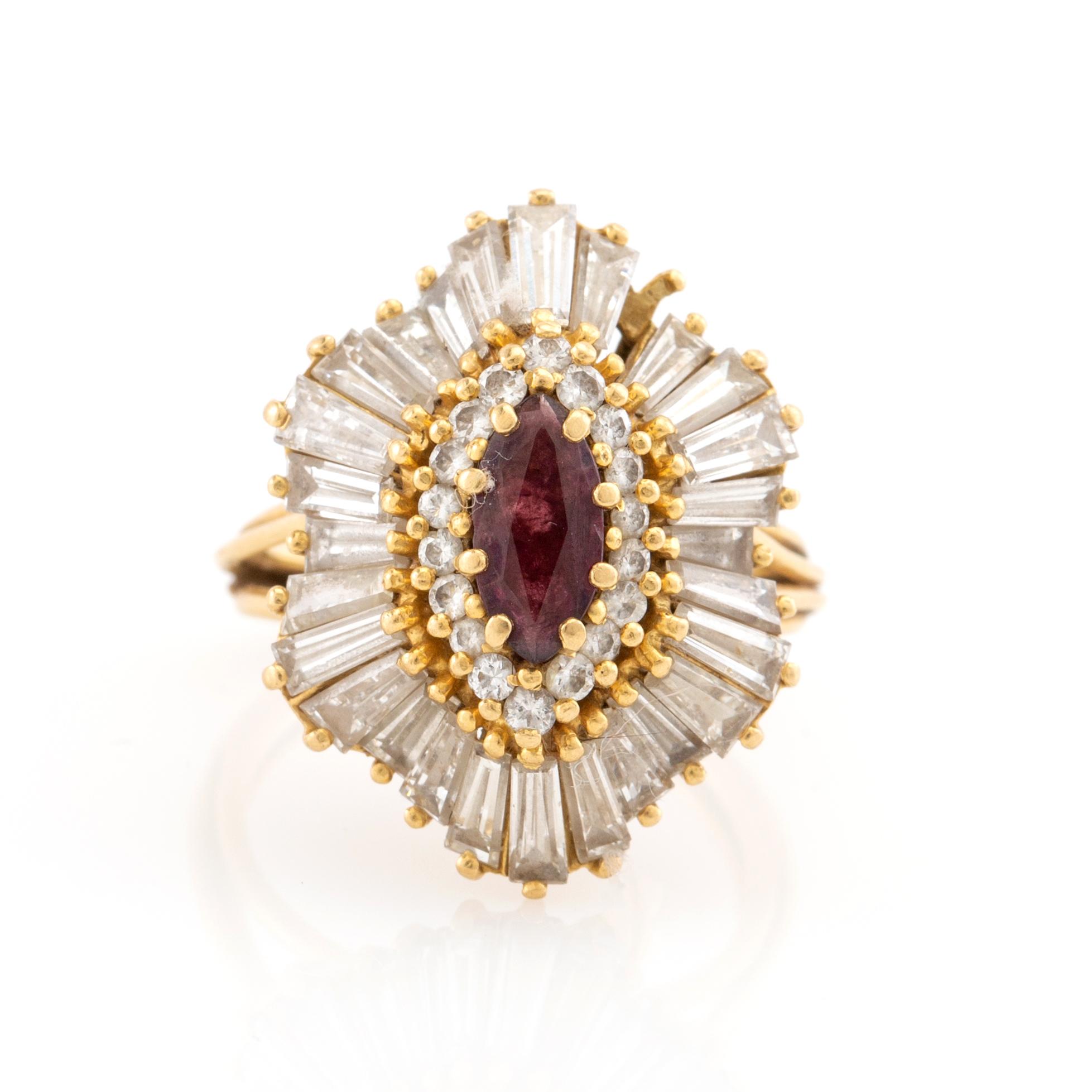 Ring in 18K gold with a marquise-cut red stone and baguette-cut diamonds.