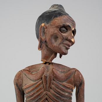 A wooden sculpture of a indian man, early 20th Century.