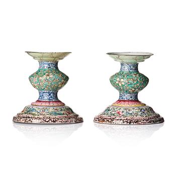 983. A pair of enamel on copper candlesticks, Qing dynasty, 19th century.
