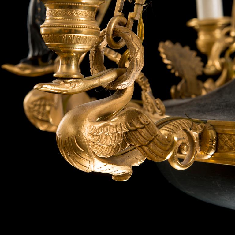 A first half 19th Century empire nine-light hanging lamp.