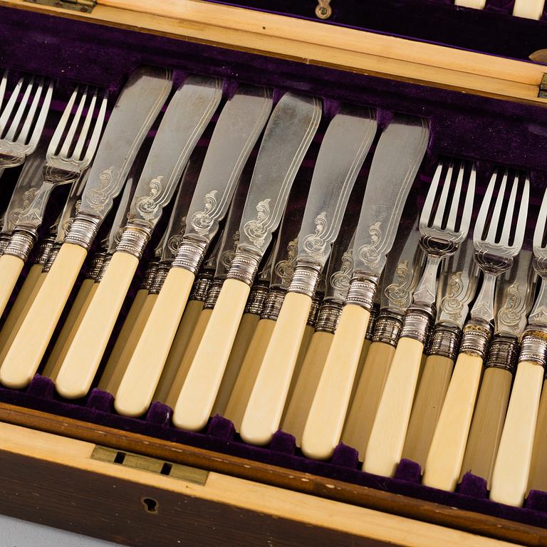 JOSEPH ELLIOT & SONS, a part silver plated and metal cutlery in a wooden box, circa 1900.