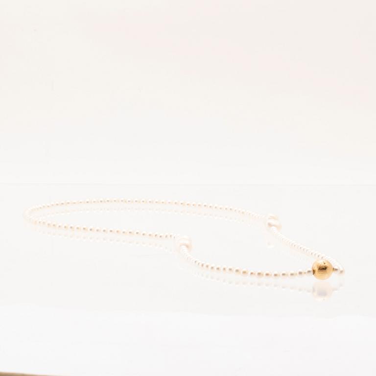 Ole Lynggaard, two cultured pearls necklaces and a bracelet with 18K gold clasp.