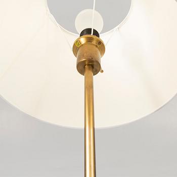 A pair of brass floor lamps from NK (Nordiska Kompaniet) later part of the 20th century.