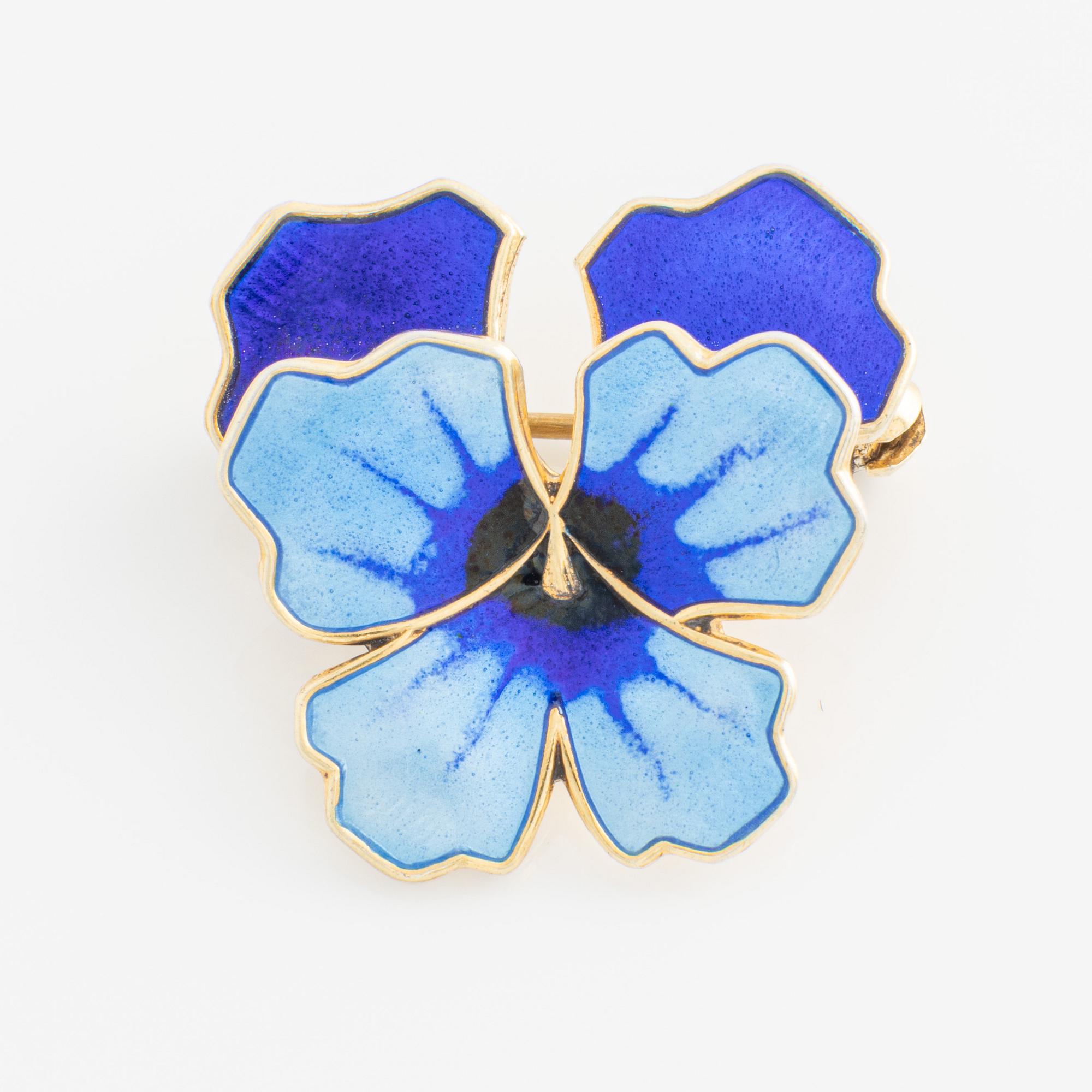 David Andersen, bracelet and two brooches, gilded silver and enamel, Norway.