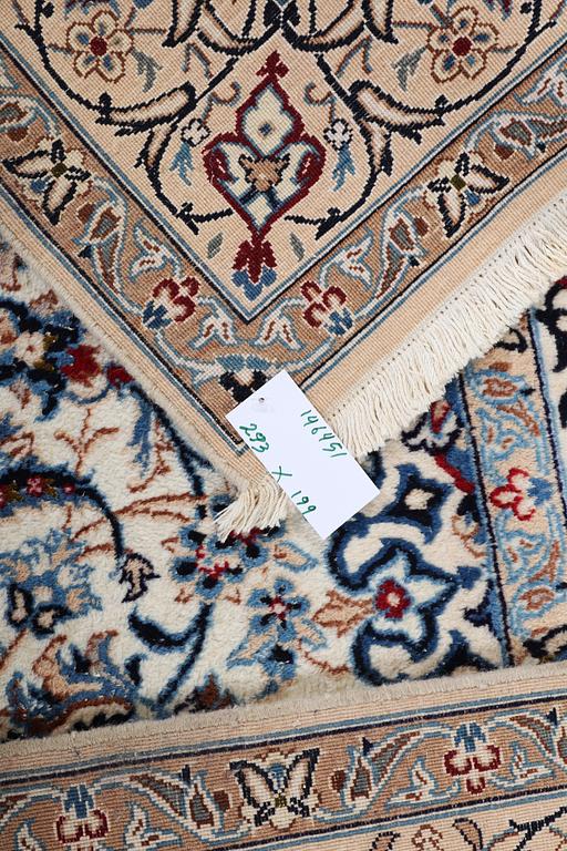 A Nain carpet, part silk, c. 293 x 199 cm.