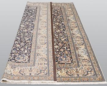 A Nain carpet, part silk, so-called 6 LAA, approx. 324 x 210 cm.