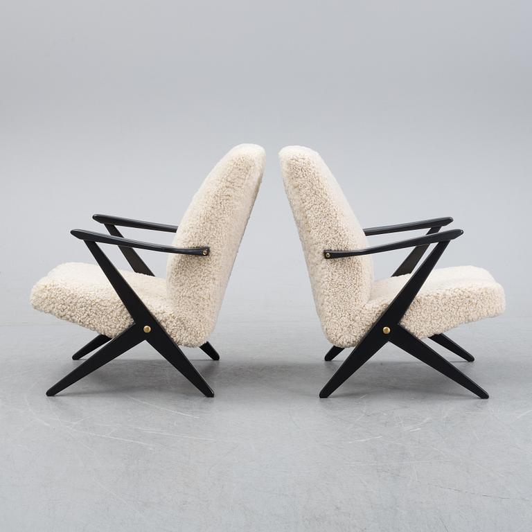 A pair of model 563-037 easy chairs by Bengt Ruda for Nordiska Kompaniet, designed 1952.