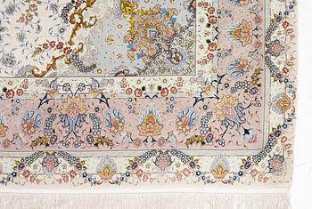 A Tabriz carpet north west Persia, part silk, c. 314 x 197 cm.