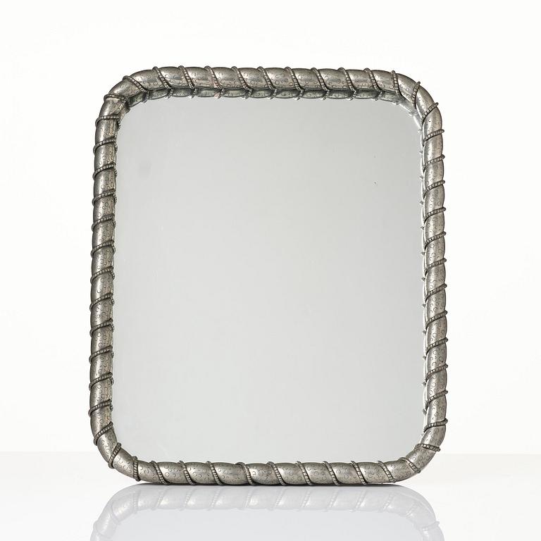 Estrid Ericson, a pewter framed mirror model "A 2518", Firma Svenskt Tenn, Stockholm, 1947.