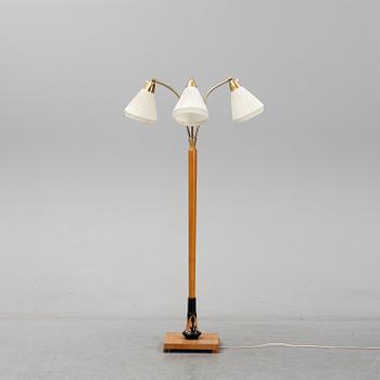 An elm floor light, mid 20th Century.