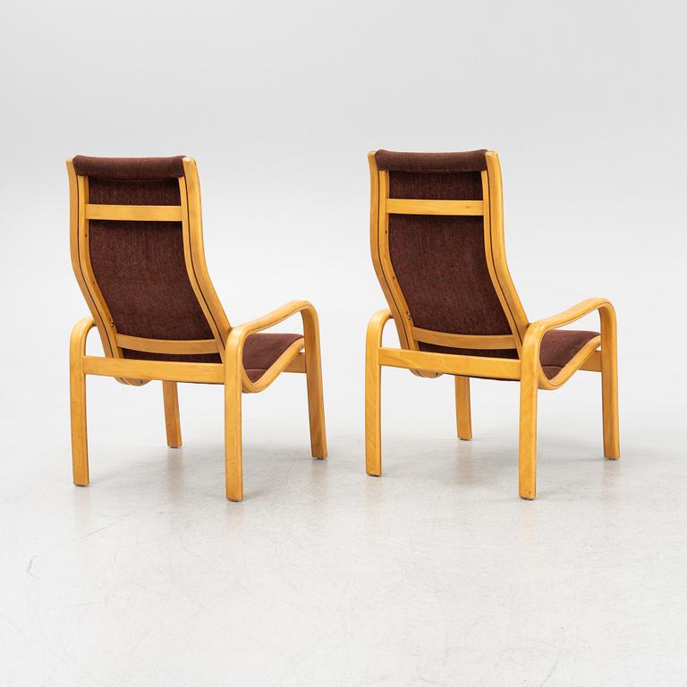 Yngve Ekström, a pair of armchairs, Swedese, late 20th century.
