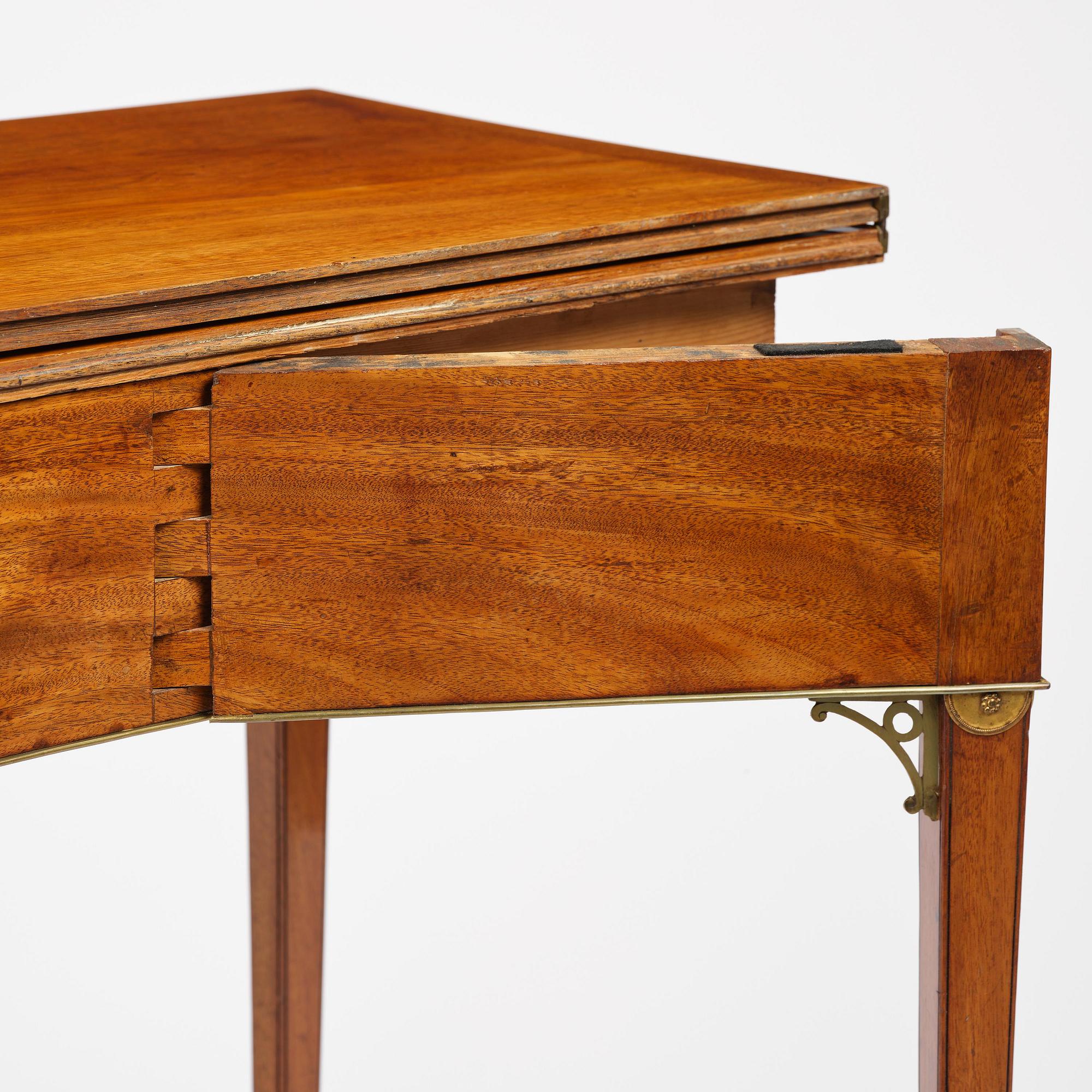 A late Gustavian mahogany games table, presumably by A. Nordström (Journeyman at G. Iwersson 1806-09).
