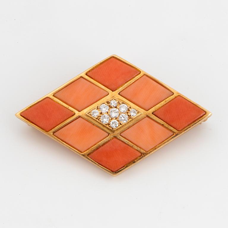 Coral and brilliant-cut diamond brooch.