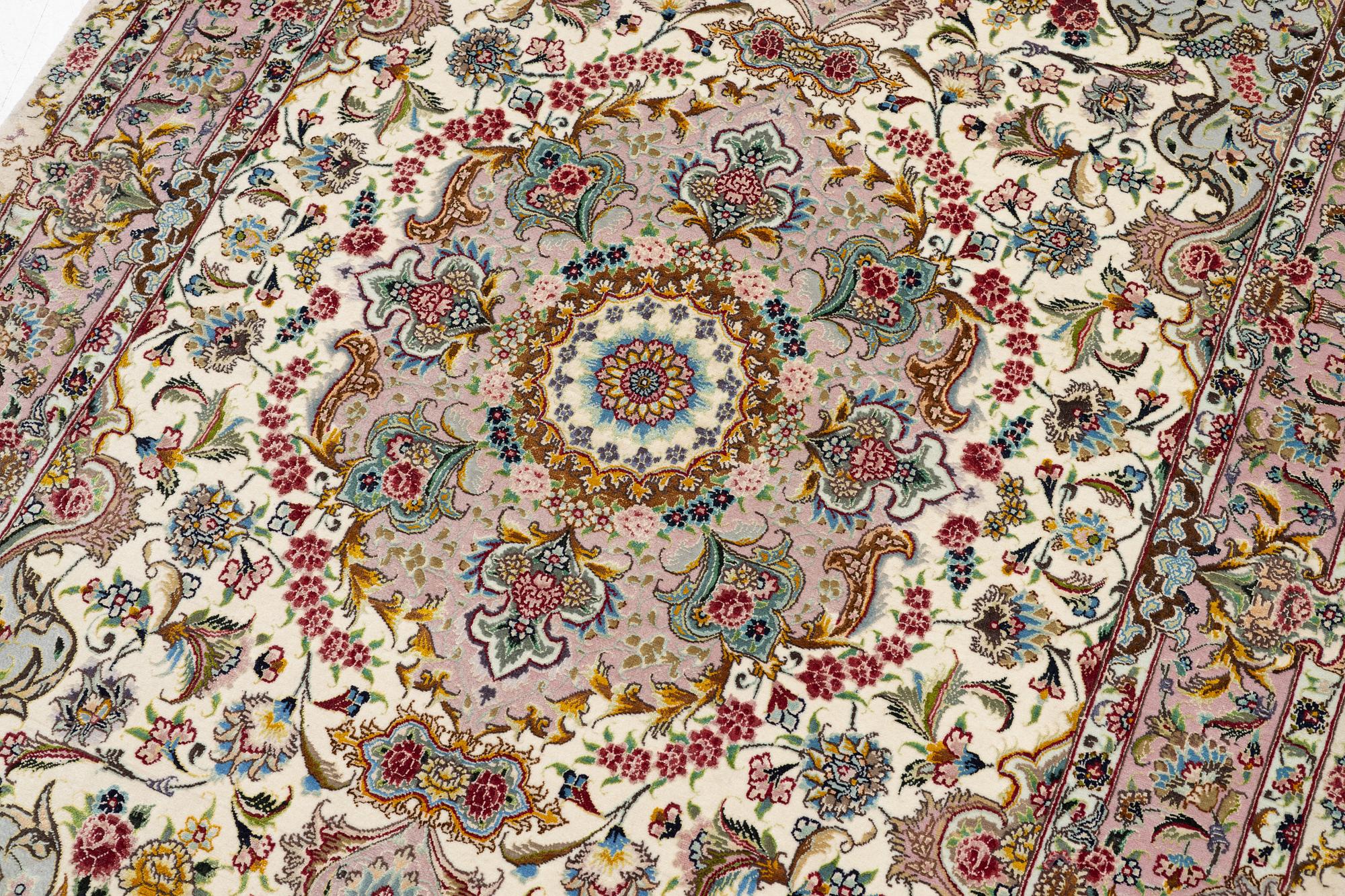 A Tabriz rug, signed, c. 160 x 101 cm.