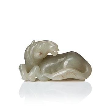 667. A carved nephrite figure of a reclining horse, Qing dynasty.