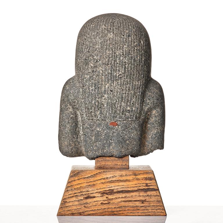An Egyptian black granite bust of a man, 19th century or older.