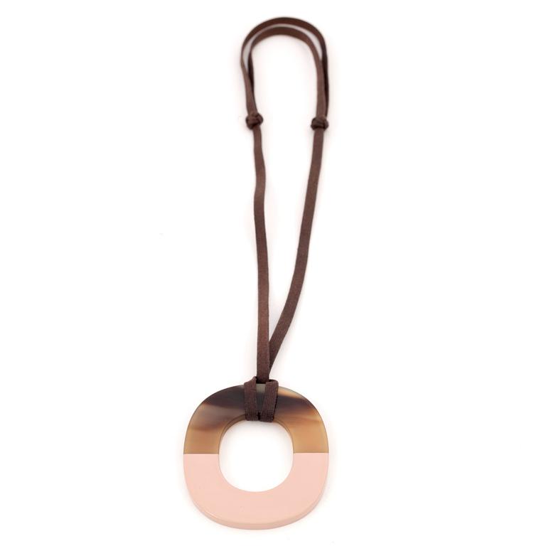 HERMÈS, a pendant in buffalo horn and brick lacquered wood with waxed cotton cord, "Isthme".