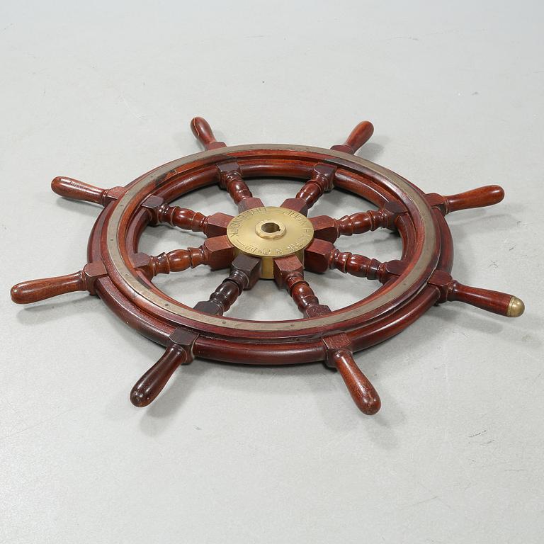 A ship wheel from John Hastie & Co, Greenrock, 20th century.