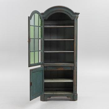 A 19th century vitrine cabinet.