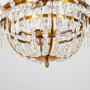 A Gustavian style chandelier from the first half of the 20th century. Height 67 cm.