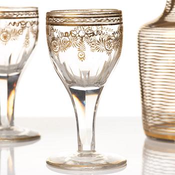 A set of six Russian glass goblets and a bottle with stopper, 19th Century.