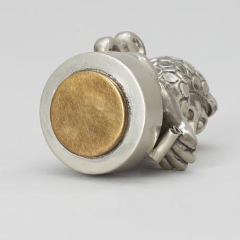 An Anna Petrus pewter and brass seal by Svenskt Tenn 1981.